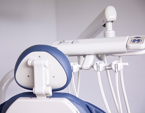 Man in dental chair giving thumbs up