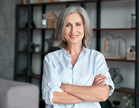 mature woman smiling with dental crowns in Edison 