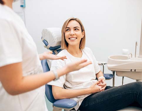 dentist talking to patient