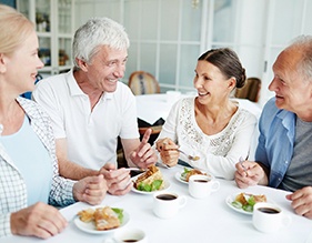 Group of people enjoying a meal together