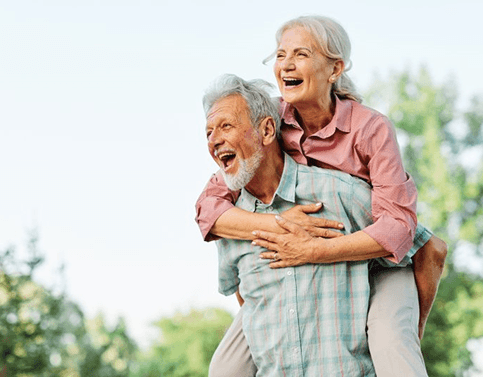 a mature couple laughing and having fun together