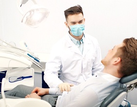 Implant dentist in Edison speaking with a patient