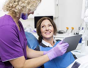 dentist showing a patient their X-rays