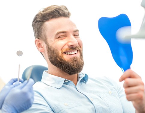 Man smiling after dental consultation in Edison (Who is a Good Candidate for IV Sedation?