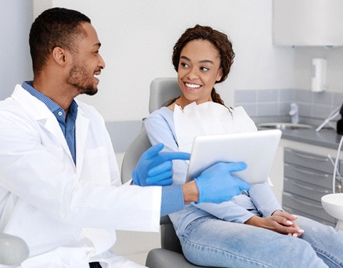 Patient talking with her Edison cosmetic dentist