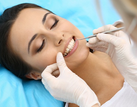 Woman receiving scaling and root planing treatment