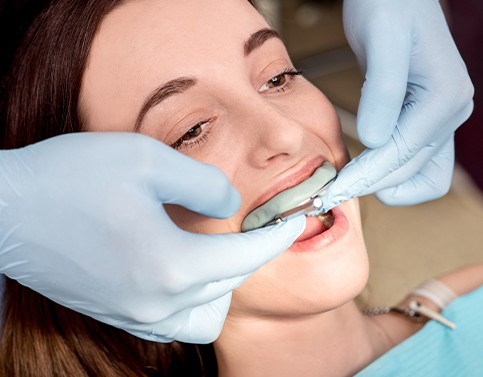 Woman receiving fluoride treatment