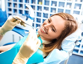 Woman smiling at a dentist