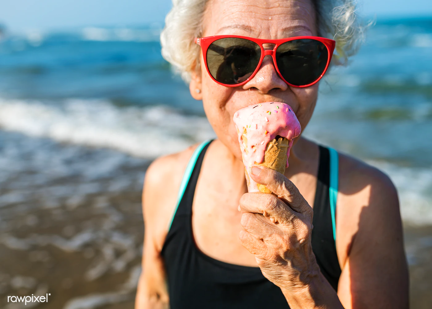 elderly person with dentures eating ice cream