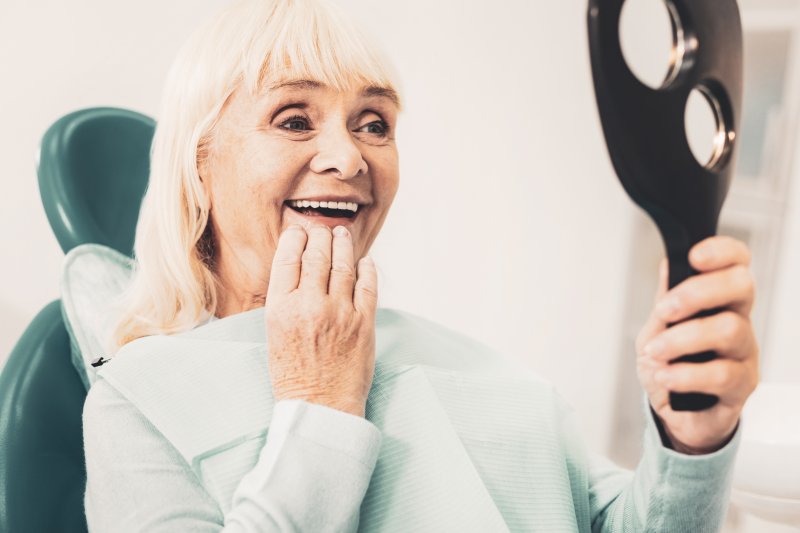 A closeup of a senior woman with dentures