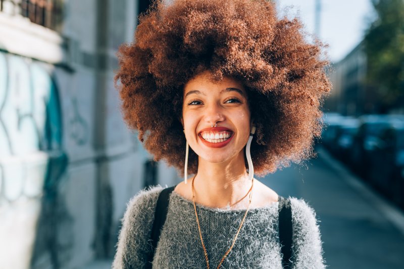 person who had root canal therapy smiling 